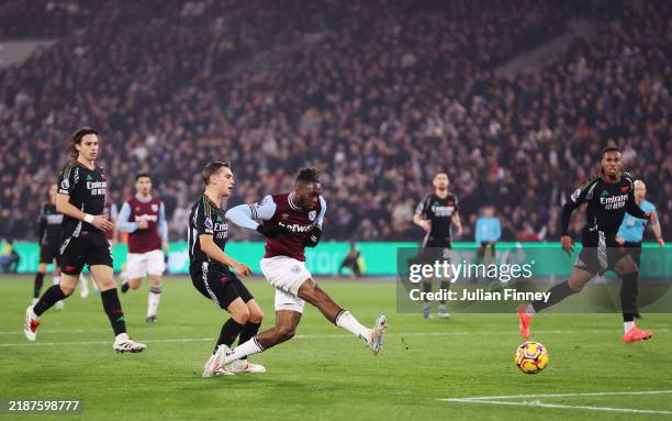 Aaron Wan-Bissaka of West Ham United scores his team's first goal during the Premier League match between West Ham United FC and Arsenal FC at London...