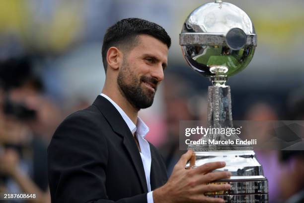Novak Djokovicholds the tophy prior to the Copa CONMEBOL Libertadores 2024 Final between Atletico Mineiro and Botafogo at Estadio Más Monumental...