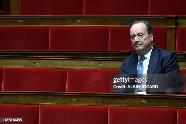 Socialistes et Apparentes' MP Francois Hollande attends the debate on the final finance bill for 2024 at the National Assembly in Paris on December...