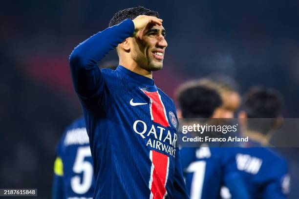 Achraf Hakimi of PSG celebrates after scoring his team's first goal during the Ligue 1 match between Paris Saint-Germain FC and FC Nantes at Parc des...