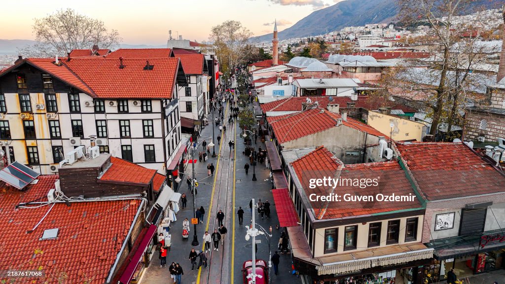 Aerial View of Cumhuriyet Street in Bursa, Turkey, Surrounded by Traditional Ottoman-Style Architecture and Bustling City Life