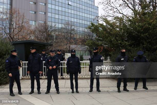 Police officer take security measures as hundreds of teachers in Kosovo march in the capital Pristina to protest the failure to sign a collective...