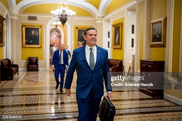 President-elect Donald Trump's nominee to be CIA Director John Ratcliffe walks out of a meeting with Senate Minority Whip John Thune on December 4,...