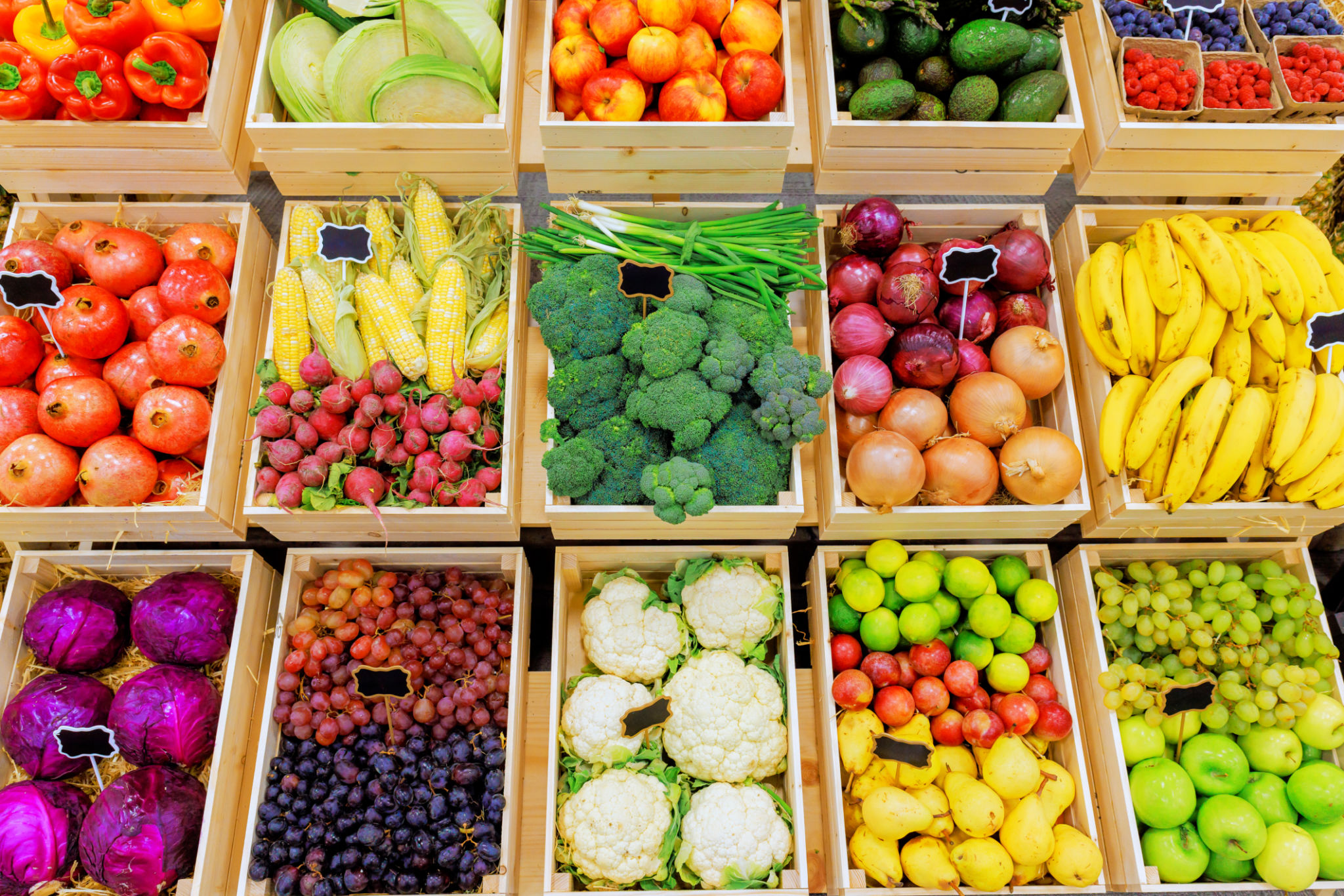Colorful display of fresh fruits, vegetables in farmer market stall during day Colorful display of fresh fruits, vegetables in farmer market stall during day