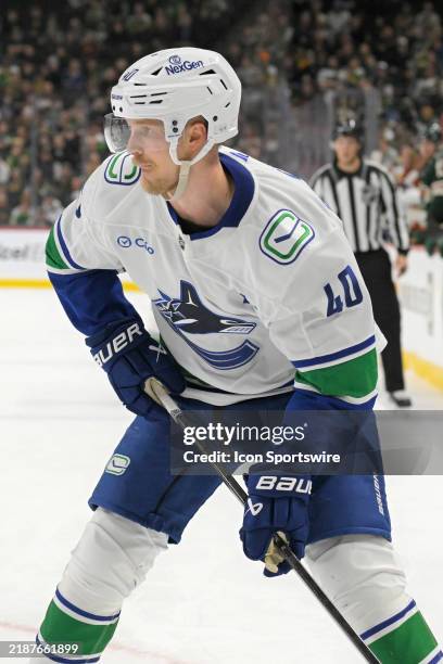 Vancouver Canucks forward Elias Pettersson looks to pass during an NHL game between the Minnesota Wild and Vancouver Canucks on December 3 at Xcel...