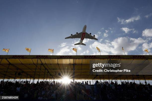 An Airbus A380 operated by Emirates Airline performs a fly-by on day two of the HSBC SVNS at The Sevens Stadium on December 01, 2024 in Dubai, United...