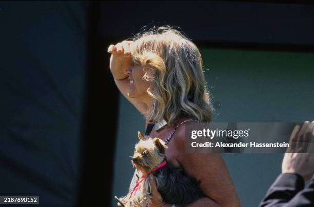 Heid Graf holding her pet Yorkshire Terrier, during the Lipton Championship at the Crandon Park Tennis Center in Key Biscayne, Florida, March 1995....