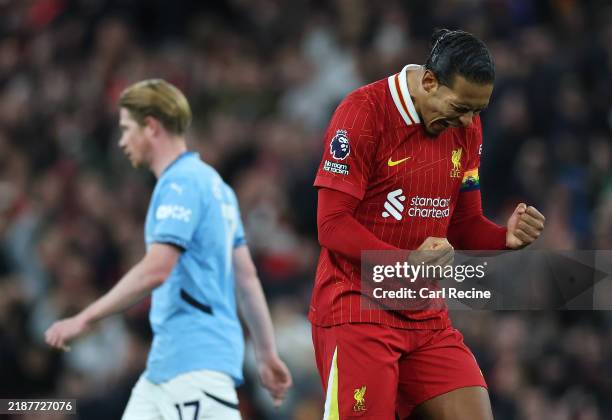 Virgil van Dijk of Liverpool celebrates at the final whistle following the team's victory during the Premier League match between Liverpool FC and...