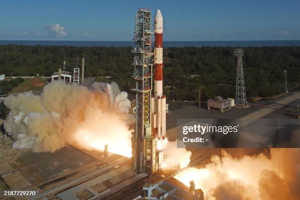 This handout photo taken and released by Indian Space Research Organisation on December 5 shows the launch of PSLV-C59 carrying two satellites of...
