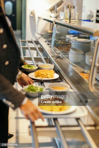 two business women having a lunch break - canteen stock pictures, royalty-free photos & images