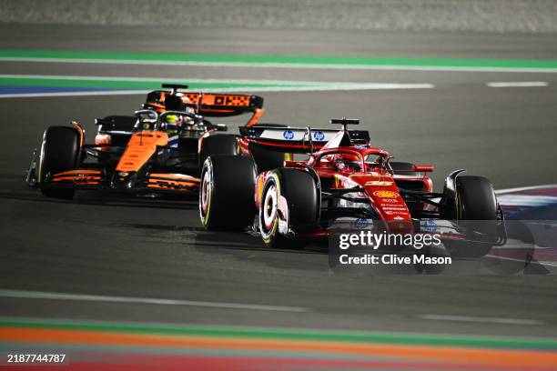 Charles Leclerc of Monaco driving the Ferrari SF-24 leads Oscar Piastri of Australia driving the McLaren MCL38 Mercedes on track during the F1 Grand...