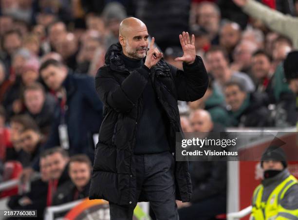 Manchester City manager Pep Guardiola holds up six fingers to indicate the six premier league titles he has won after Liverpool fans sing 'You're...