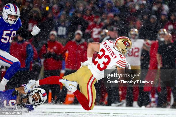 Christian McCaffrey of the San Francisco 49ers is tackled by Taylor Rapp of the Buffalo Bills in the second quarter of a game at Highmark Stadium on...
