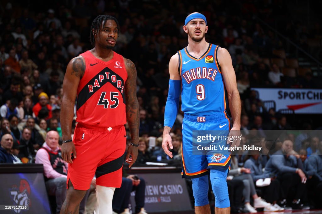 Thunder Raptors Alex Caruso of the Oklahoma City Thunder and Davion Mitchell of the ...