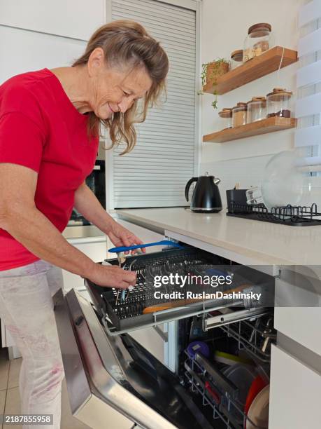 sorting utensils in the dishwasher. - rack stock pictures, royalty-free photos & images