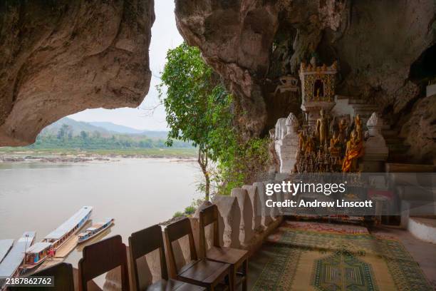 tam ting caves by the mekong river in laos - laos stock pictures, royalty-free photos & images