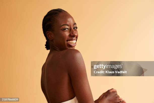 cheerful young woman wearing off shoulder - off shoulder stock pictures, royalty-free photos & images