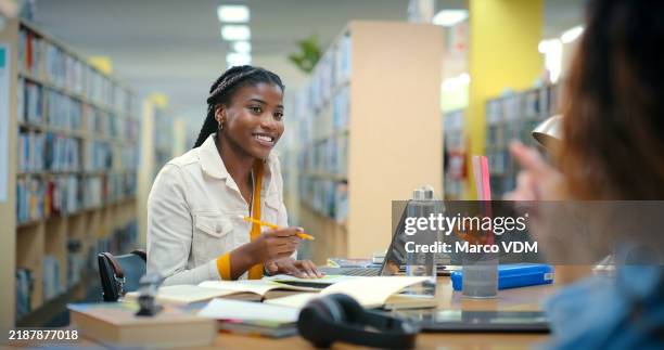 conversation, students and women in library, education and smile with knowledge. friends, university and girls with scholarship, learning and teamwork for project, assignment and advice for test - school project stock pictures, royalty-free photos & images