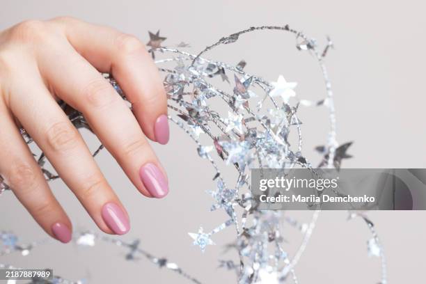 hand with beautiful manicure - pink gel nails - lacquered stock pictures, royalty-free photos & images