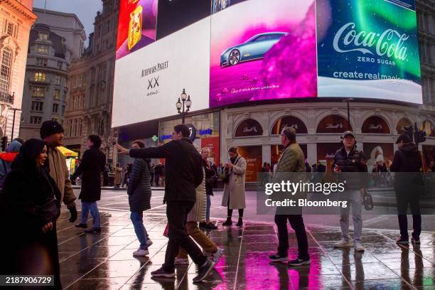 Digital screens at Piccadilly Circus display an advertisement for the Jaguar Type 00 concept car in London, UK, on Thursday, Dec. 5, 2024. Barely...
