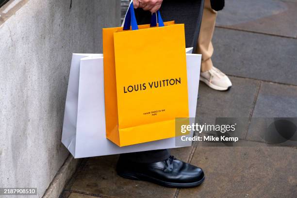 Louis Vuitton orange shopping bag on 4th December 2024 in London, United Kingdom.
