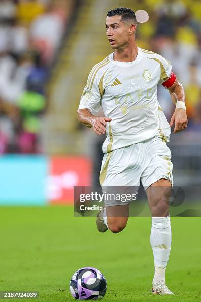 Lor Rinaldo Nassr's Portuguese forward Cristiano Ronaldo runs with the ball... News ...