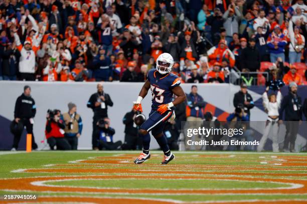 Javonte Williams of the Denver Broncos celebrates a touchdown during the first quarter in the game against the Cleveland Browns at Empower Field At...
