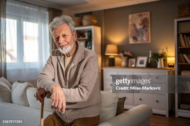 walking cane as support for a senior man - avoidance stock pictures, royalty-free photos & images