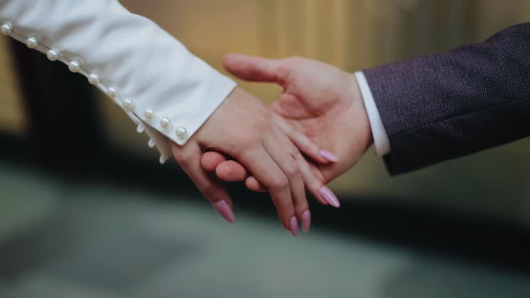 https://media.gettyimages.com/id/2188002366/video/the-man-gently-takes-his-beloveds-hand-the-lovers-hands-are-taken-in-close-up.jpg?b=1&s=640x640&k=20&c=gD2nOzMV6MNHEMvZgS9vsmM-jEK1bzV6PDnM5iatE8E=