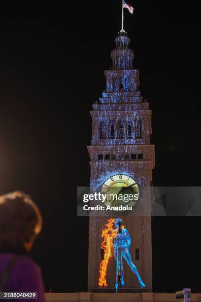 Ferry Building lit up the night during Glow SF kickoff the largest holiday projection event of the country with eight locations and mesmerizing light...