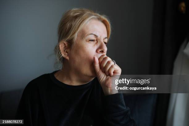 i'll have to get something for this cough - hoesten stockfoto's en -beelden