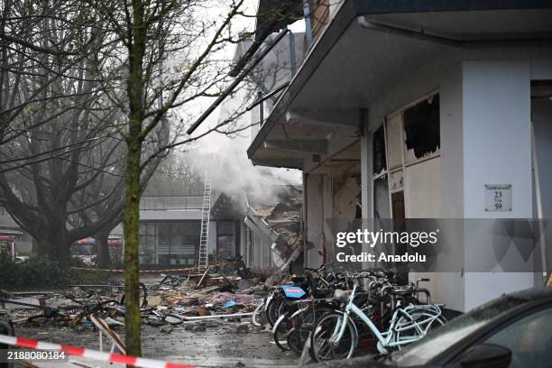 An explosion causes a partial collapse of the structure and ignited a fierce fire in a three-story apartment building in The Hague, Netherlands on...