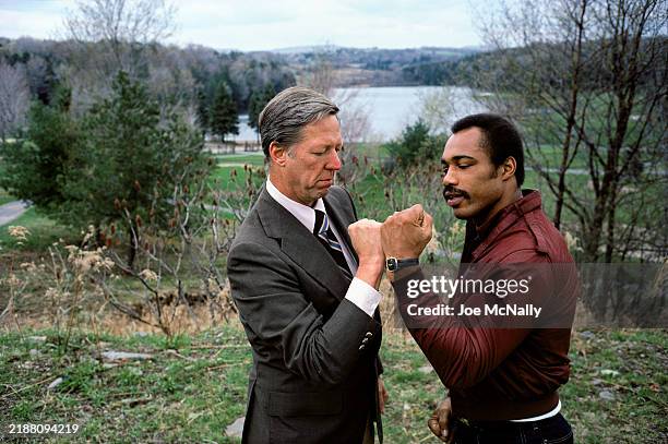 David Hartman, host of Good Morning America, with Ken Norton, professional boxer. Catskills, NY, January 1980 .