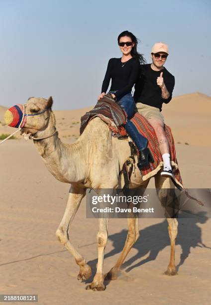 Nicola Peltz and Brooklyn Beckham take on the Abu Dhabi sands on a Desert Safari, adding excitement to their romantic getaway on December 7, 2024 in...