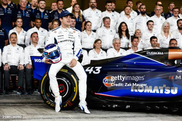 Franco Colapinto, Williams Racing, poses in front of colleagues for a team group photo during qualifying at F1 Grand Prix of Abu Dhabi - Qualifying...