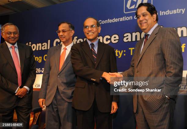 Outgoing President of CII K V Kamath greets Reserve Bank of India Governor D Subbarao at the Confederation of Indian Industry annual conference in...