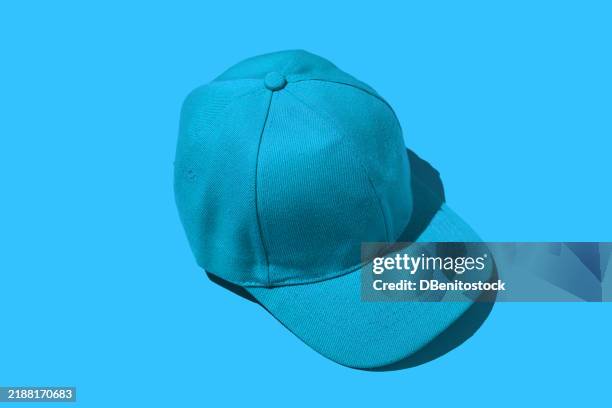 blue baseball cap, on blue background. concept of fashion, clothing, accessories, hip hop, baseball, sport, uniform and sun protection. - baseball cap stock pictures, royalty-free photos & images