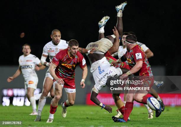Racing92's French flanker Ibrahim Diallo is tackled during the European Rugby Champions Cup pool 4 match between Racing 92 and Harlequins at the...