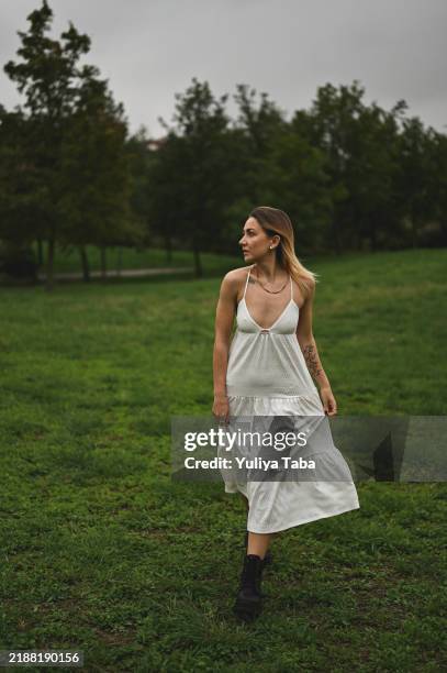 confident fashionable woman in sundress portrait in motion. - white boot stock pictures, royalty-free photos & images