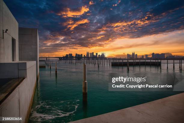 abu dhabi skyline at sunset - corniche stock pictures, royalty-free photos & images