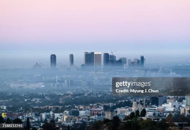 Morning haze obscures the Century City skyline as seen from Griffith Park in Los Angeles, CA on Friday, Dec. 6, 2024.