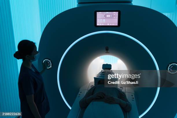 asian female nurse check the x-ray equipment. - oncologist stock pictures, royalty-free photos & images