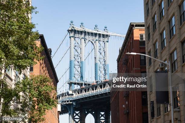 manhattan bridge and city buildings in dumbo brooklyn - brooklyn street scene stock pictures, royalty-free photos & images