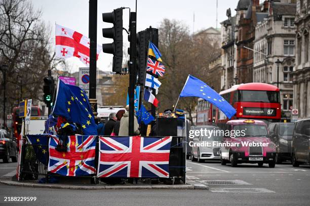 Anti-Brexit campaigners protest on a traffic island at Westminster, on December 04, 2024 in London, United Kingdom.