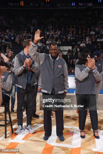 Micheal Ray Richardson is honored during Knicks Alumni night at half time of the game between the Detroit Pistons and the New York Knicks on December...