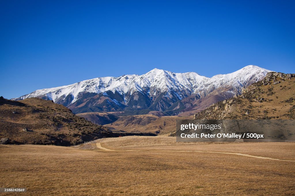 Scenic view of snowcapped mountains against clear sky,Cave Stream Scenic Reserve,Castle Hill,New Zealand