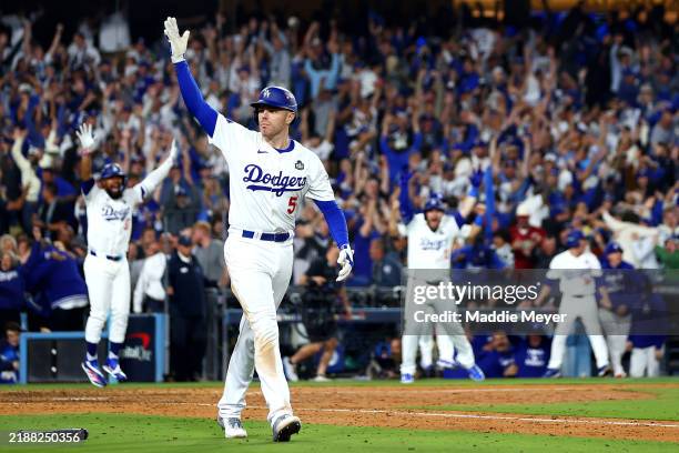 Freddie Freeman of the Los Angeles Dodgers celebrates after hitting a walk-off grand slam during the tenth inning against the New York Yankees during...