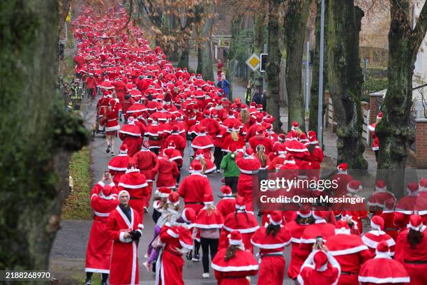 Participants dressed as Santa Claus start off in the 16th annual Michendorf Santa Run on December 8, 2024 in Michendorf, Germany. Approximately 1000...