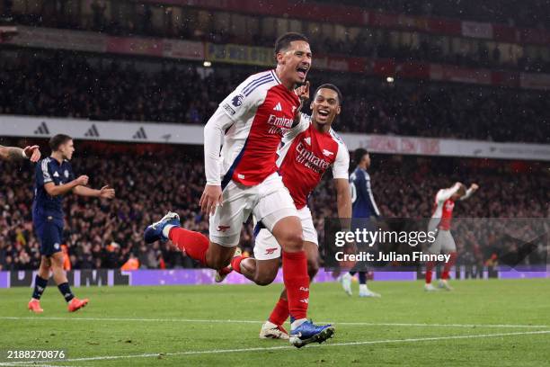 William Saliba of Arsenal celebrates scoring his team's second goal with teammate Jurrien Timber during the Premier League match between Arsenal FC...