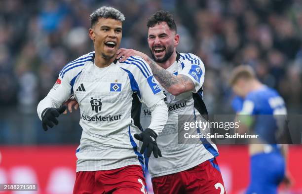 Ransford Königsdörffer and Marco Richter of Hamburg celebrate their teams first goal scoring during the Second Bundesliga match between Hamburger SV...